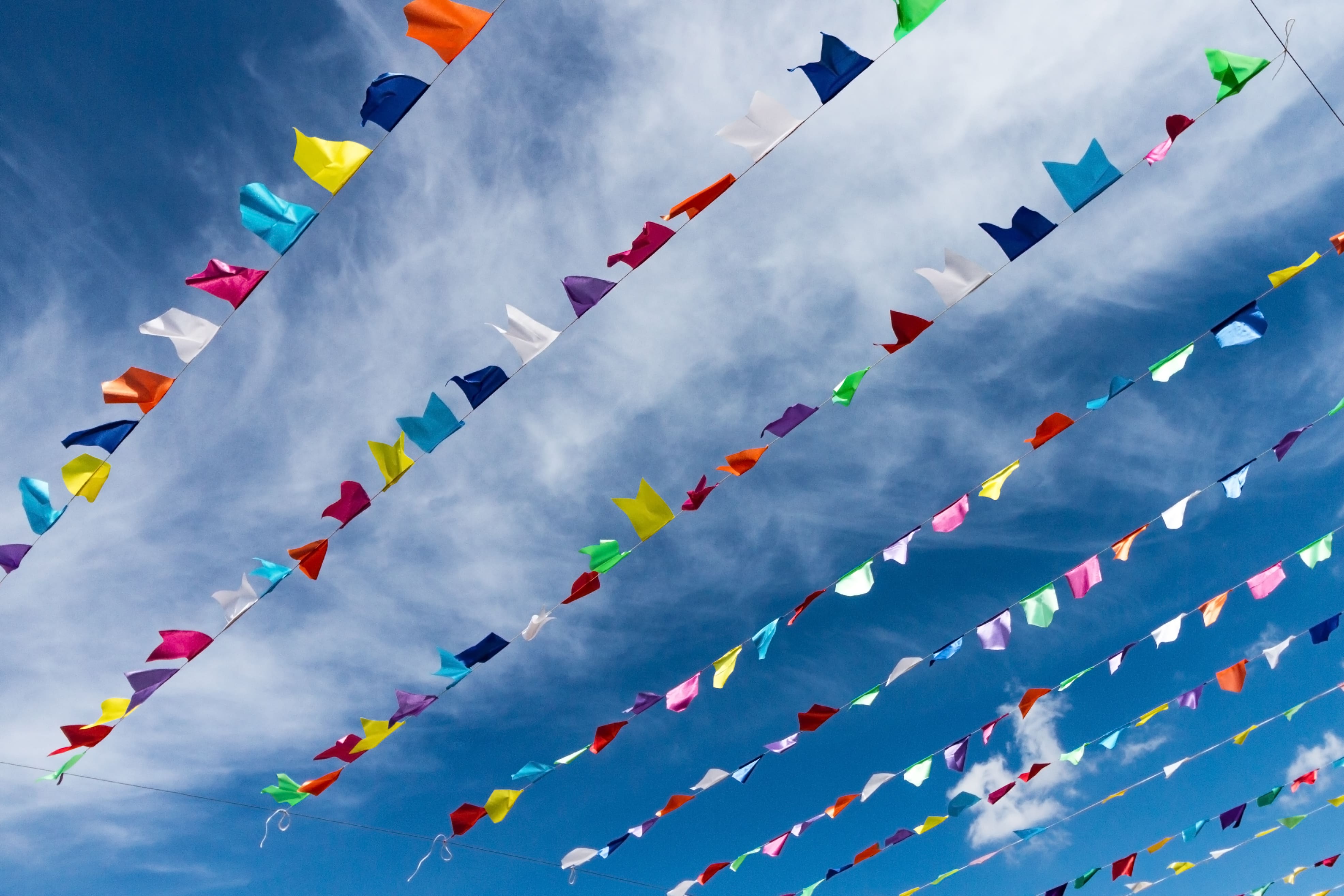 small-cute-colorful-flags-rope-hanging-outside-holiday-with-bright-blue-sky-white-clouds-background-italy-sardinia-20260528155239.jpg
